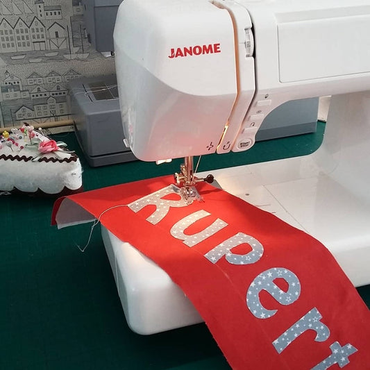 Machine applique letters on a piece of fabric