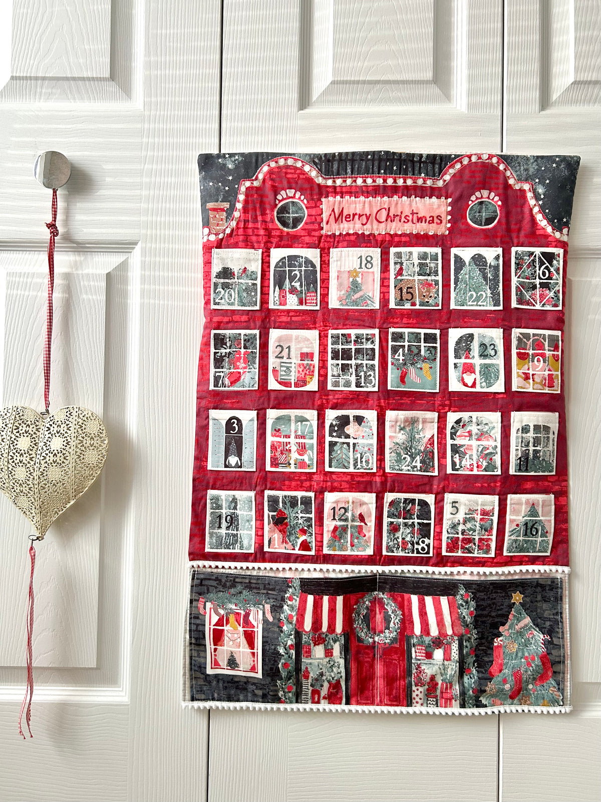 Sew your own advent calendar house with windows for pockets
